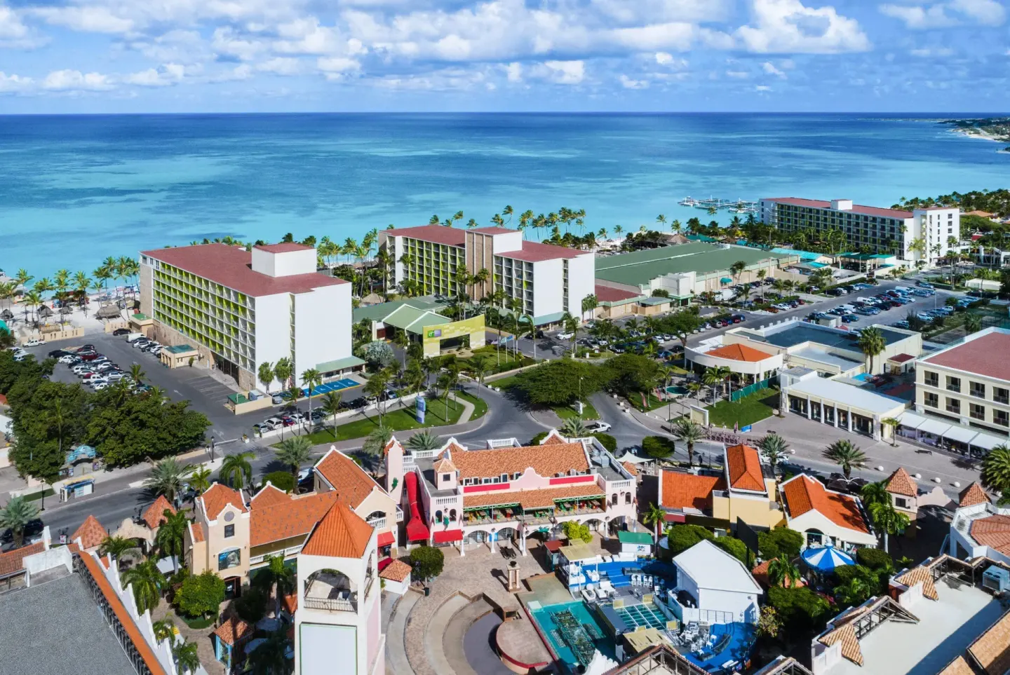 Aerial view of resort buildings by the ocean at Holiday Inn Resort Aruba - Beach Resort & Casino.