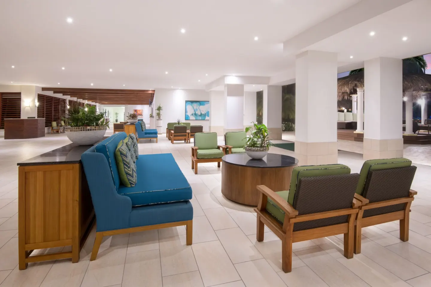 Open lobby lounge with colorful seating at Holiday Inn Resort Aruba - Beach Resort & Casino.