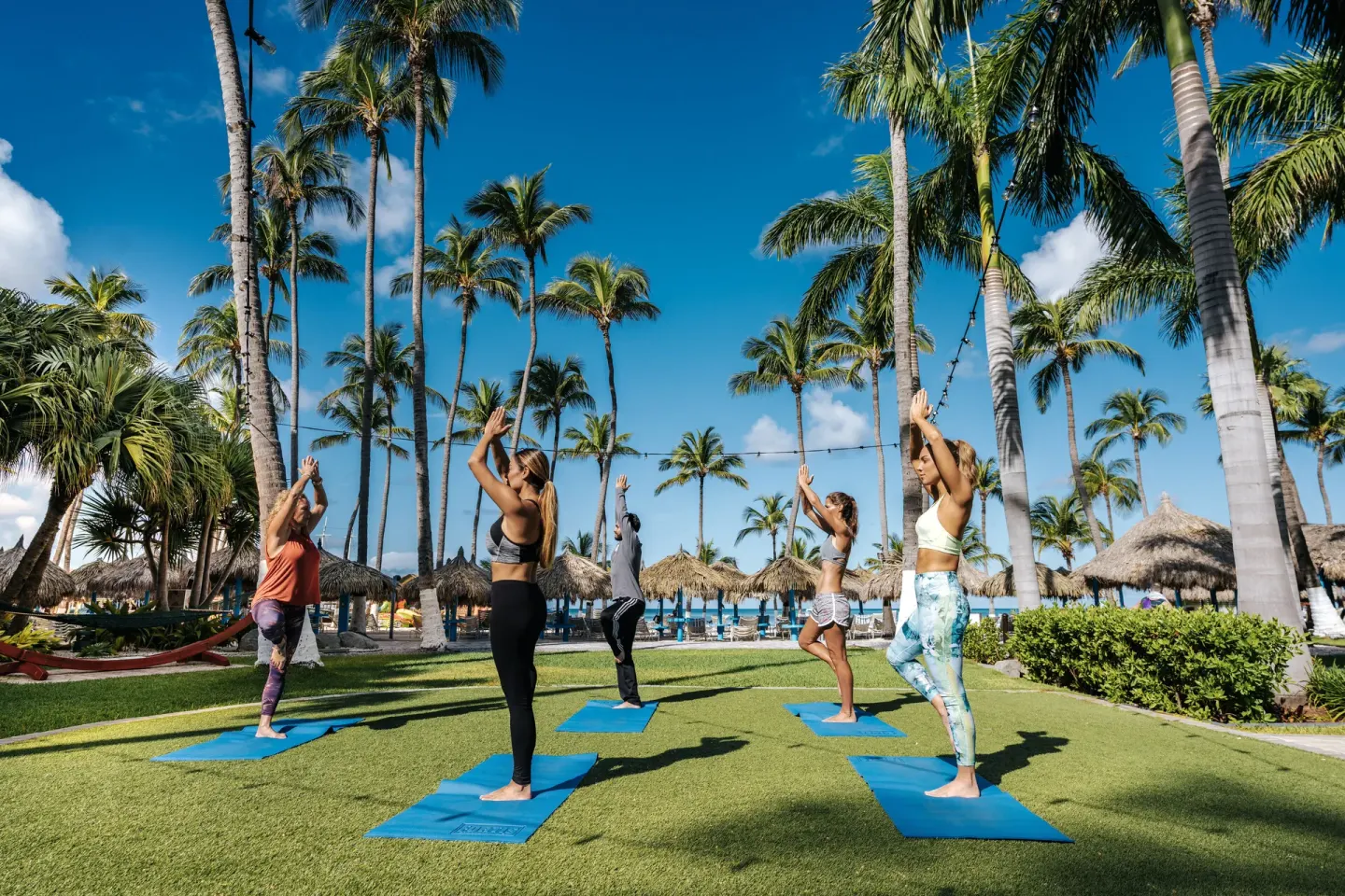 Outdoor yoga class on the lawn at Holiday Inn Resort Aruba - Beach Resort & Casino.