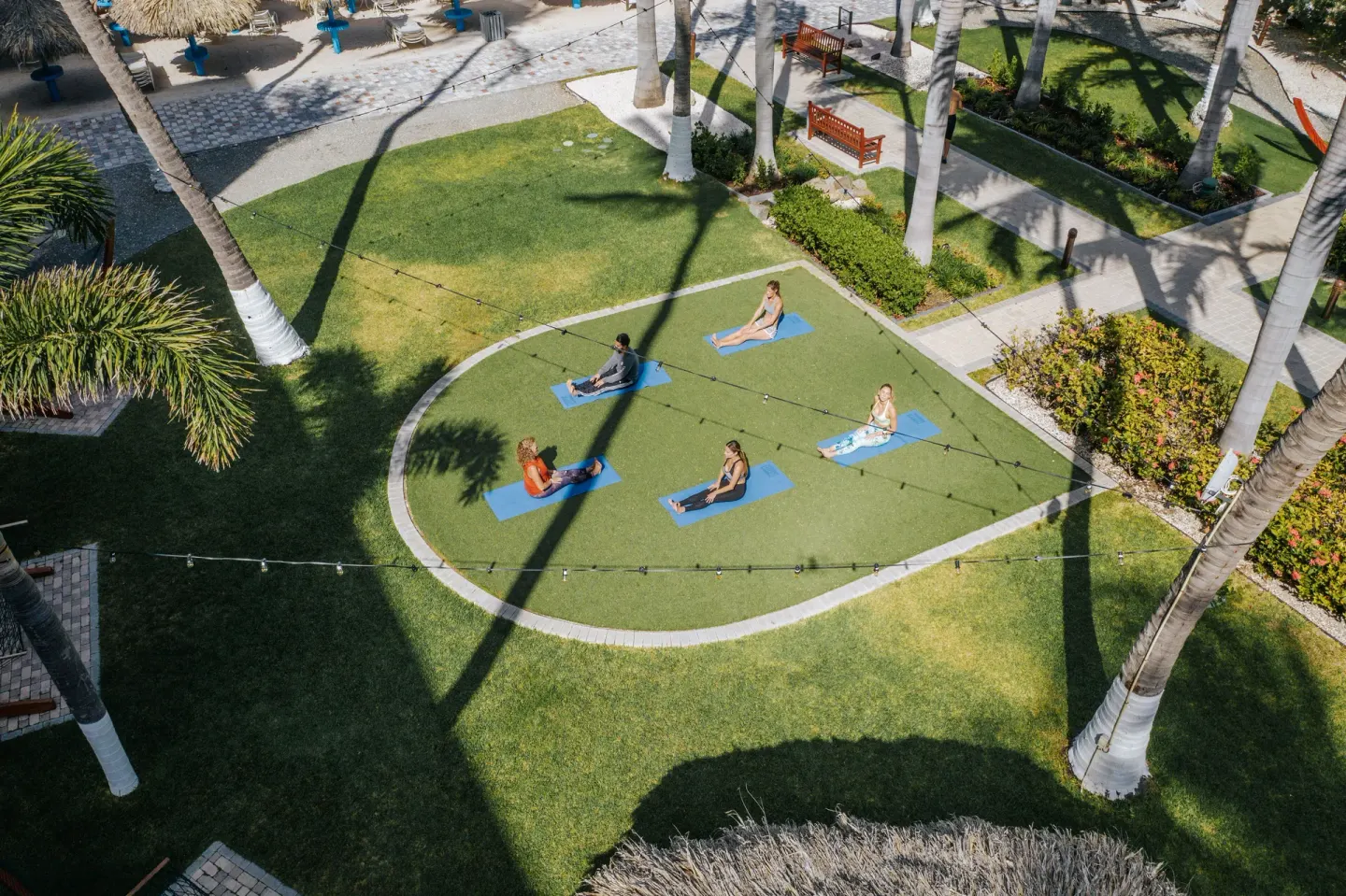 Outdoor yoga class on the lawn at Holiday Inn Resort Aruba - Beach Resort & Casino.