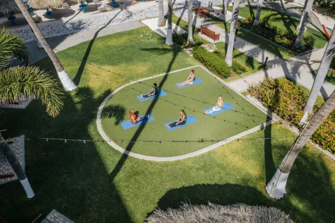 Outdoor yoga class on the lawn at Holiday Inn Resort Aruba - Beach Resort & Casino.