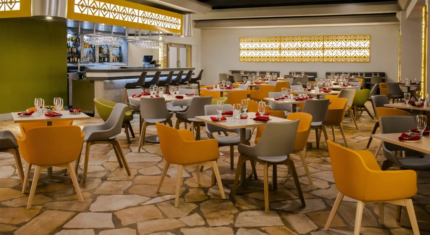 Modern restaurant dining room and bar at Holiday Inn Resort Aruba - Beach Resort & Casino.