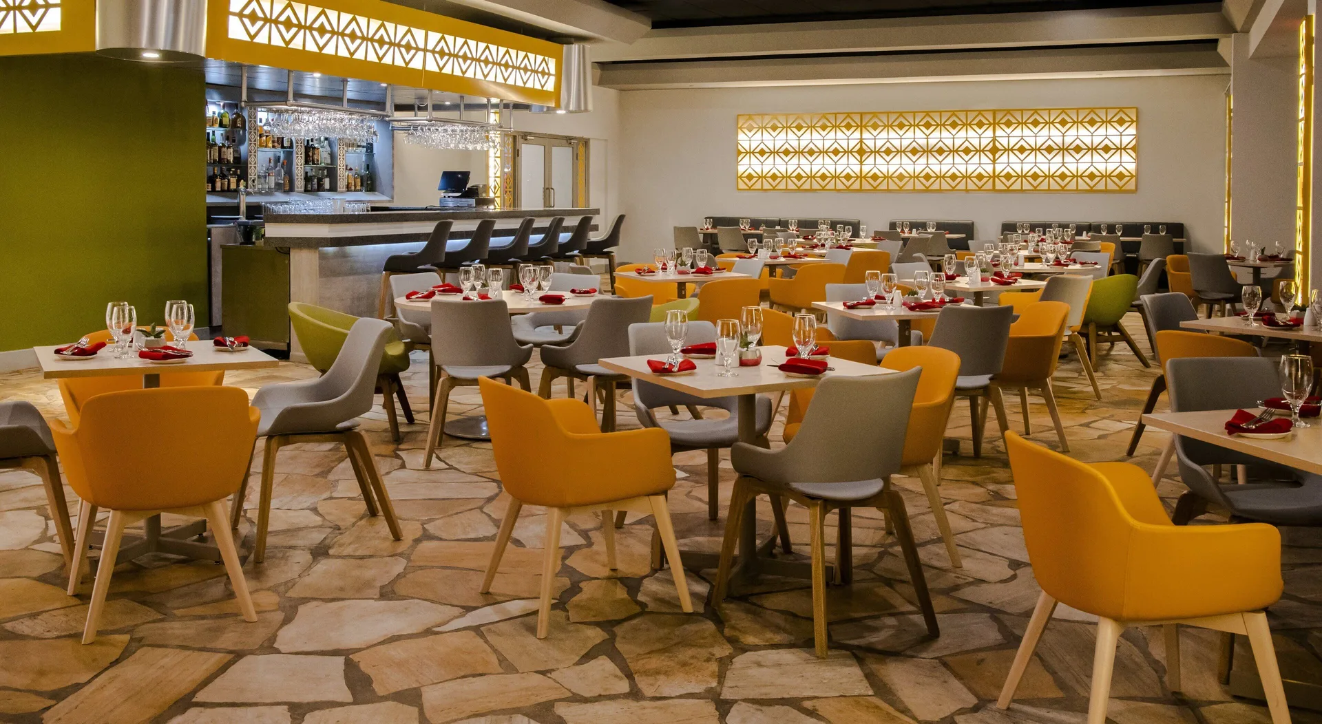 Modern restaurant dining room and bar at Holiday Inn Resort Aruba - Beach Resort & Casino.