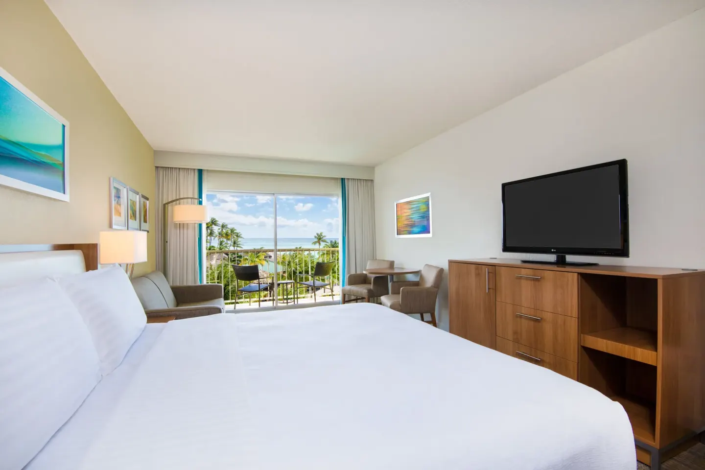 Standard Partial Ocean View king room with balcony at Holiday Inn Resort Aruba - Beach Resort & Casino.