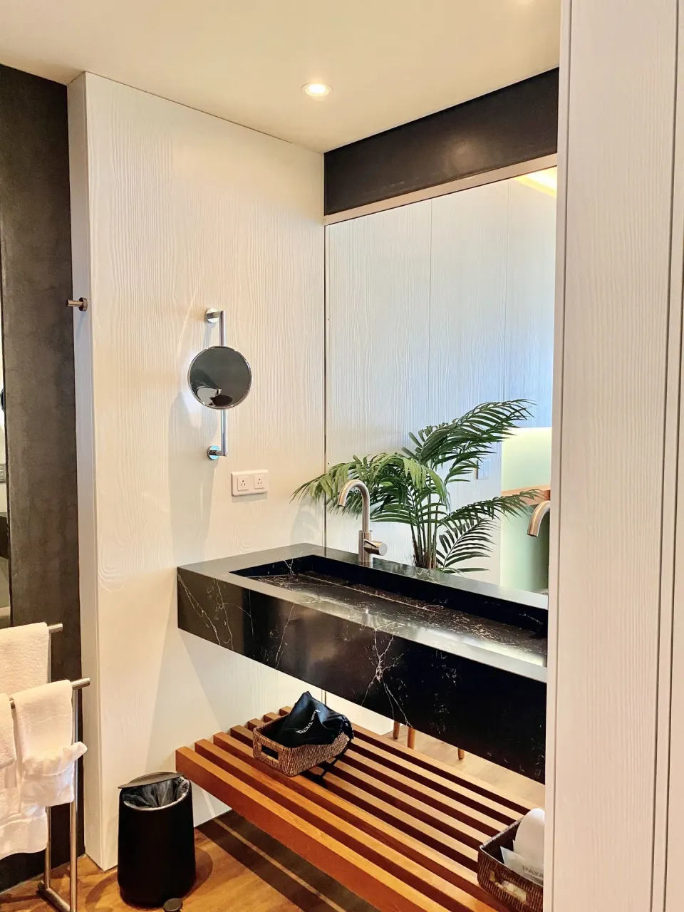 Executive Suite City View bathroom mirror and floating vanity at Holland House Beach Hotel.