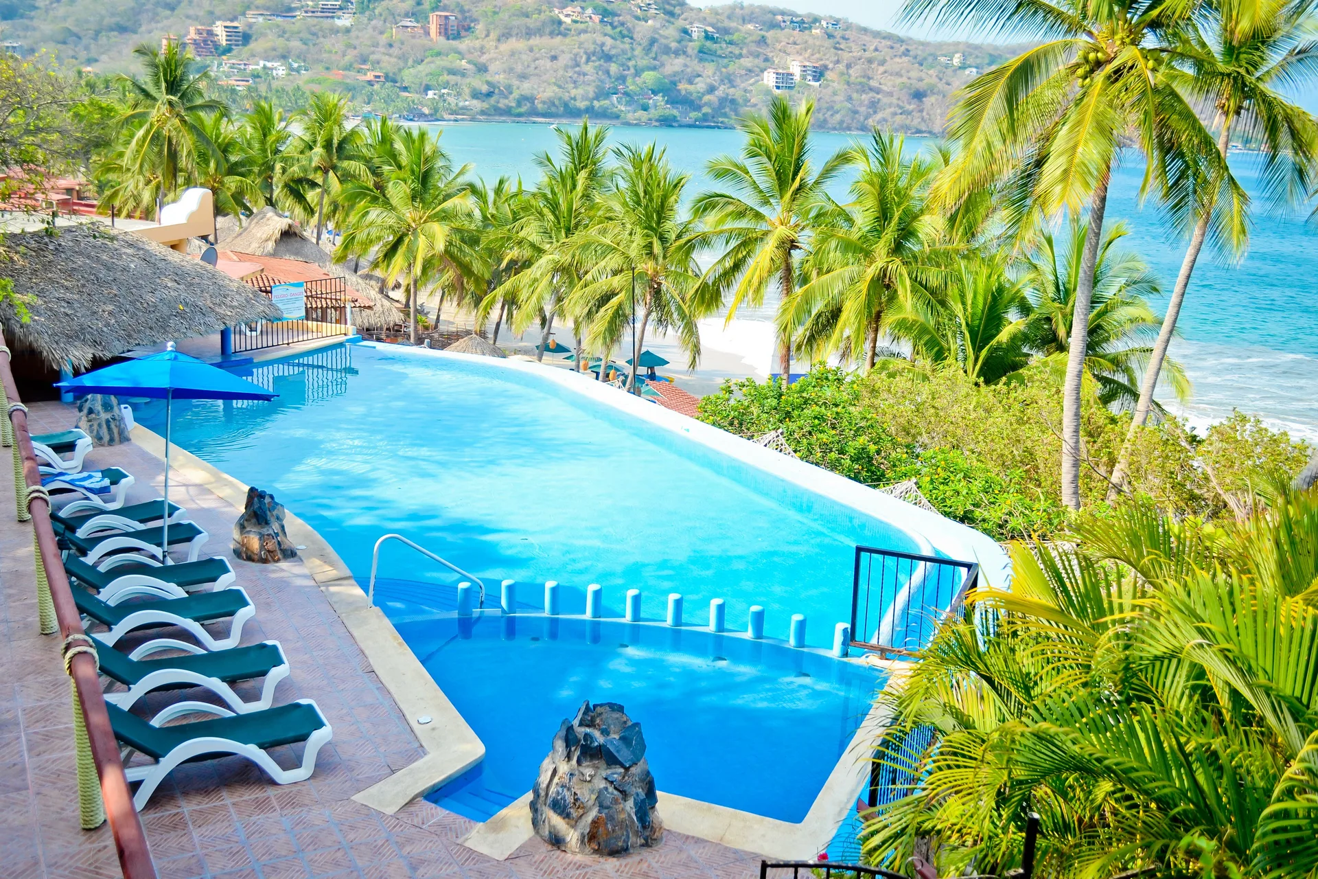 Catalina Beach Resort hillside beach hotel with tropical setting and Playa La Ropa views