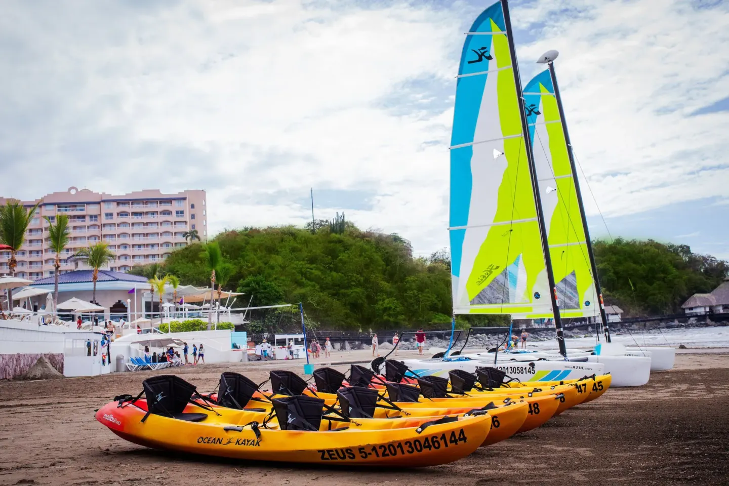 Kayaks and sailboats on the beach at Hotel Azul Ixtapa Grand Resort Spa.