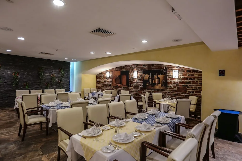 Italian-style dining room with brick alcove at Hotel Azul Ixtapa Grand Resort Spa.