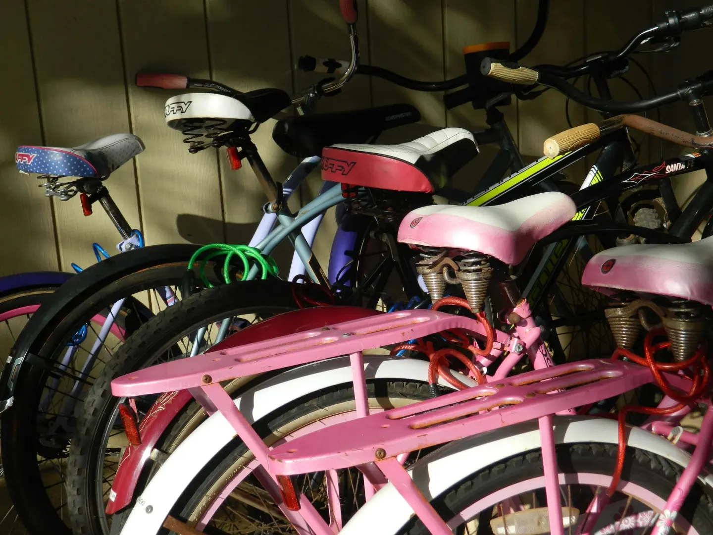 Parked colorful bicycles in storage at Hotel Coral Reef.