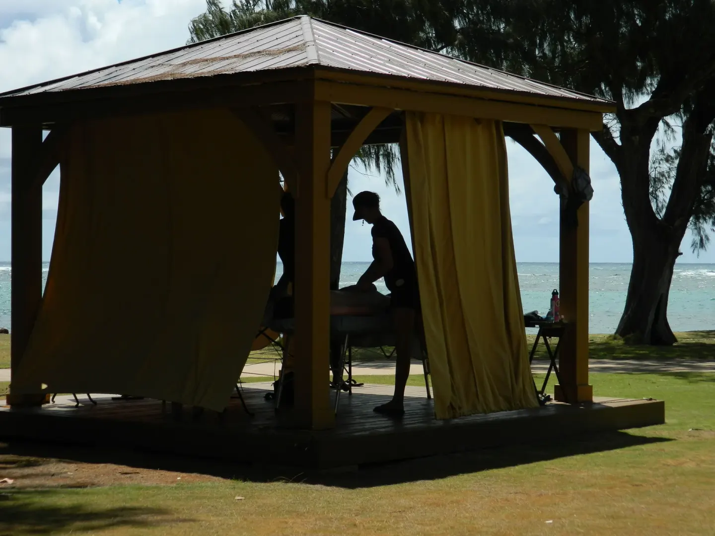 Massage cabana with ocean behind it at Hotel Coral Reef.