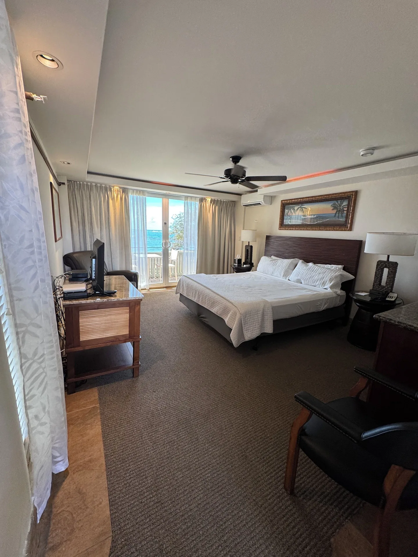 Panoramic Room with king bed and balcony ocean view at Hotel Coral Reef.