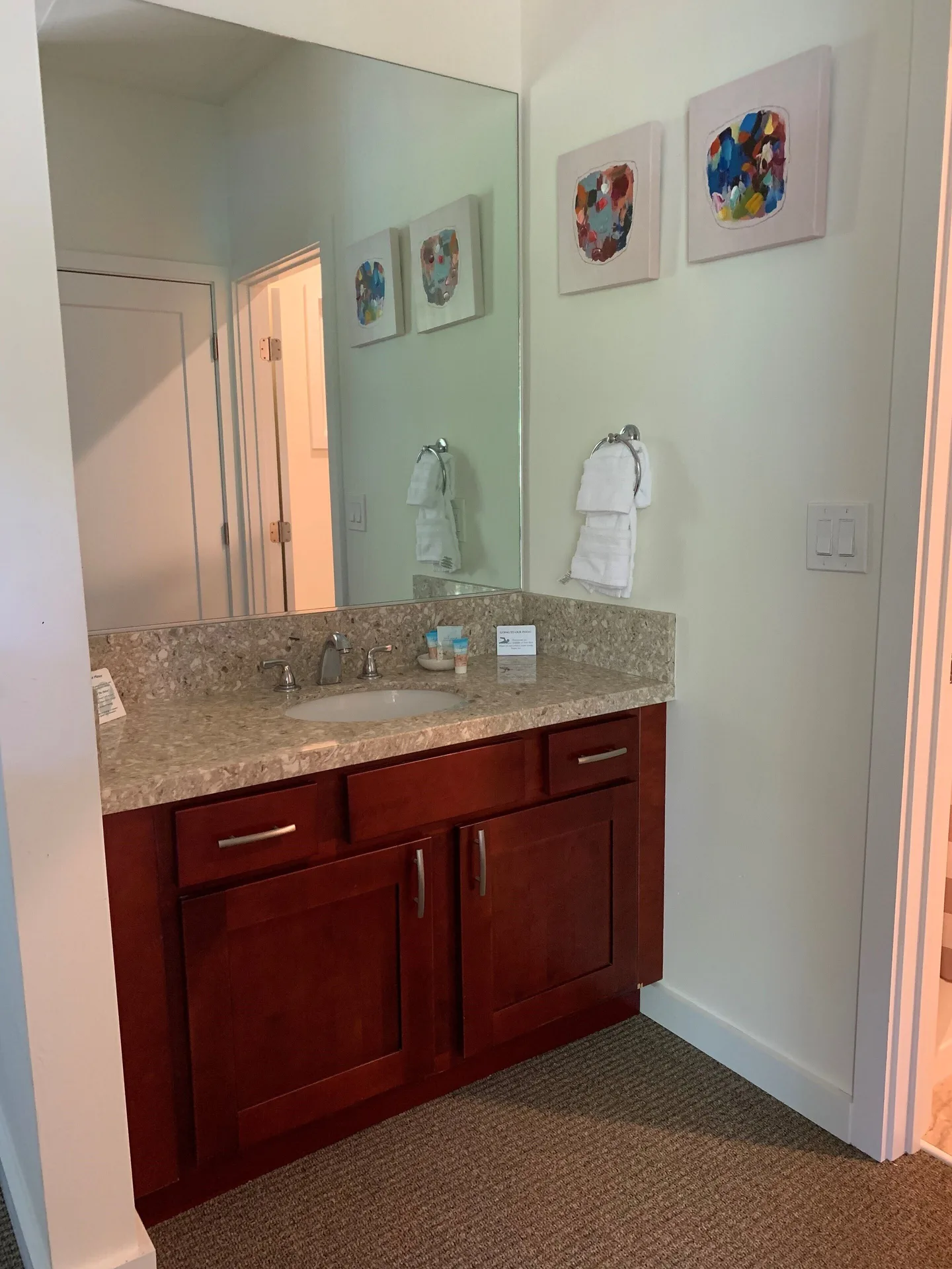 Premium Room Oceanfront vanity with sink and mirror at Hotel Coral Reef.