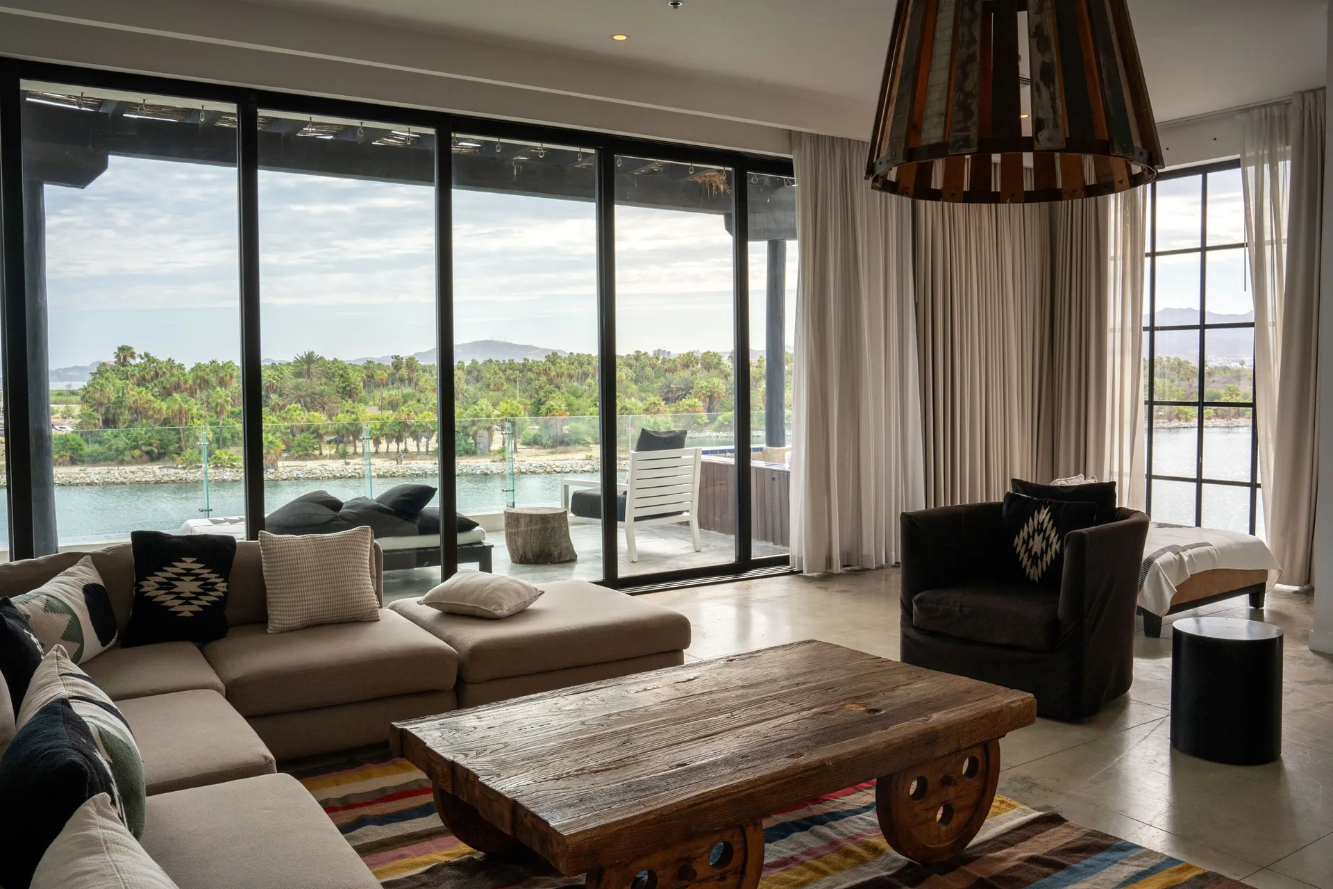 Captain's Suite living room with terrace and water view at Hotel El Ganzo.