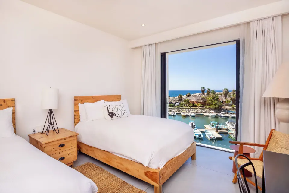 Ocean View Two Beds room with marina and ocean view through the window at Hotel El Ganzo.