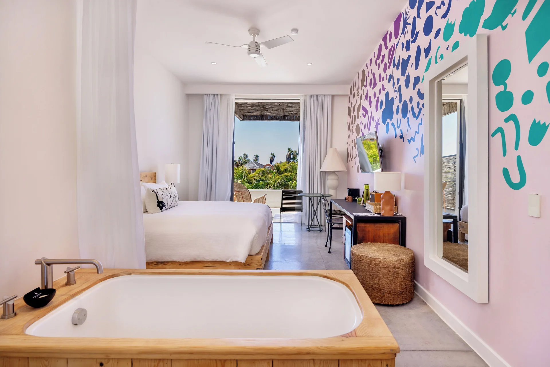 Terrace guest room with king bed, soaking tub, and balcony at Hotel El Ganzo.