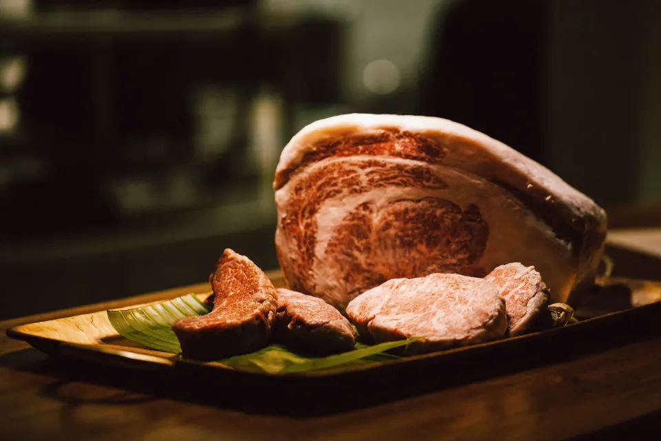 Platter of cured and sliced meats on a tray at Hotel Esencia