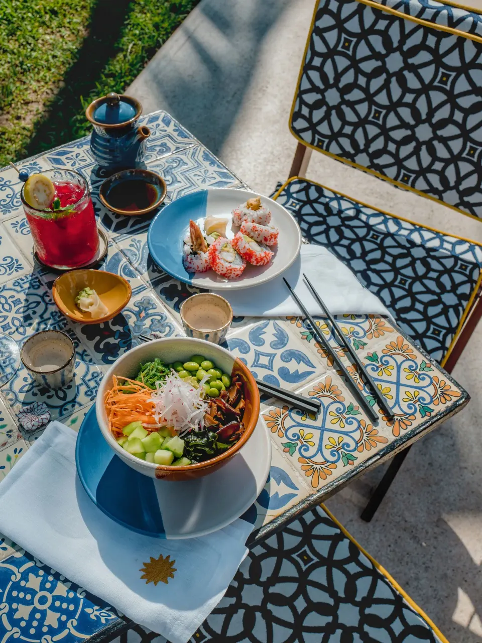 Poke bowl and rolls on patterned tiles at Hotel Esencia