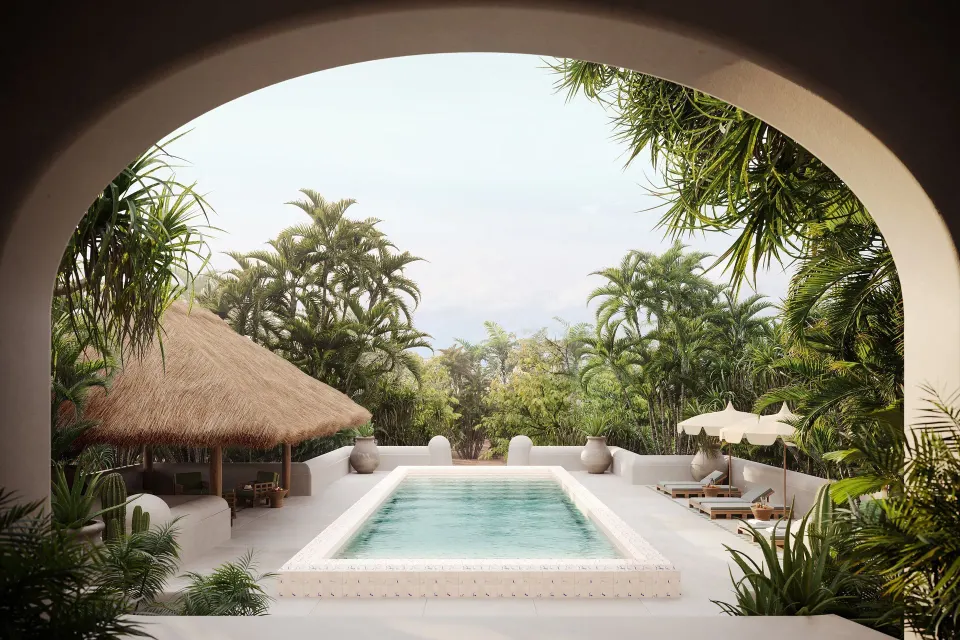 Arch-framed view of a private plunge pool and thatched palapa at The Hotel Esencia at Hotel Esencia