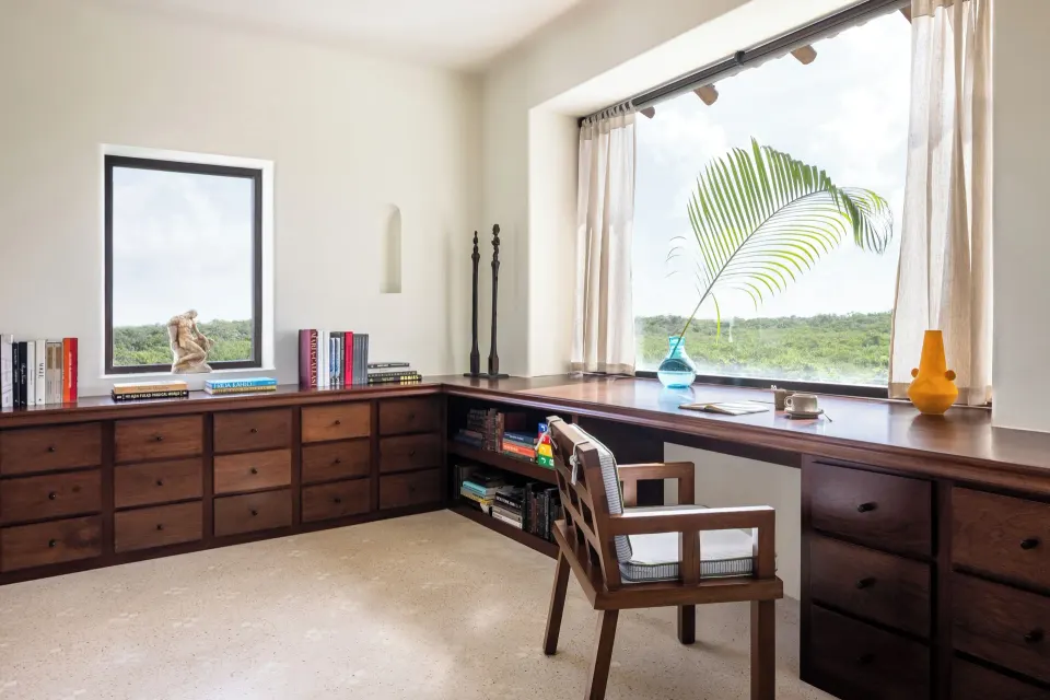 Wooden desk with built-in drawers and a large window view in The Hotel Esencia at Hotel Esencia