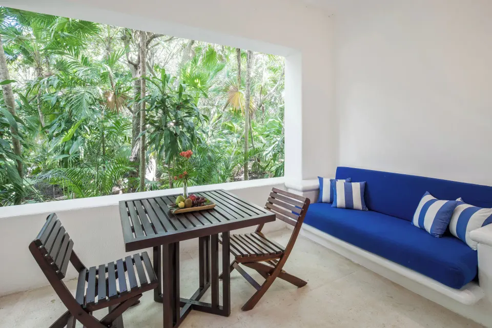Covered terrace seating and dining area of the Jungle Suite at Hotel Esencia