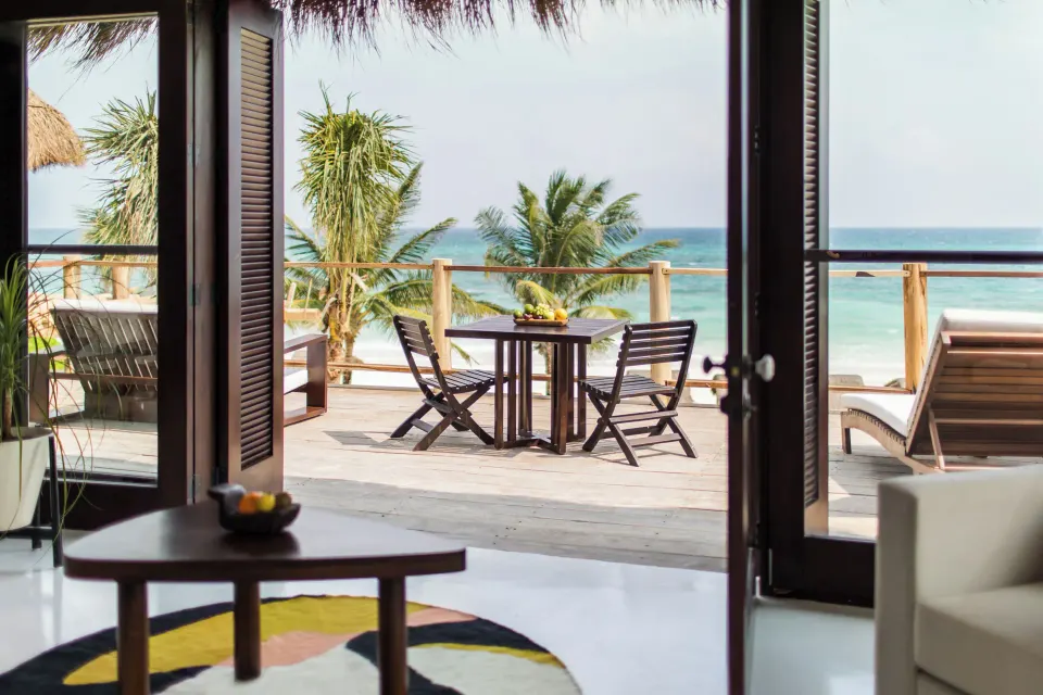 View from inside the master suite out to a beachfront balcony at Hotel Esencia