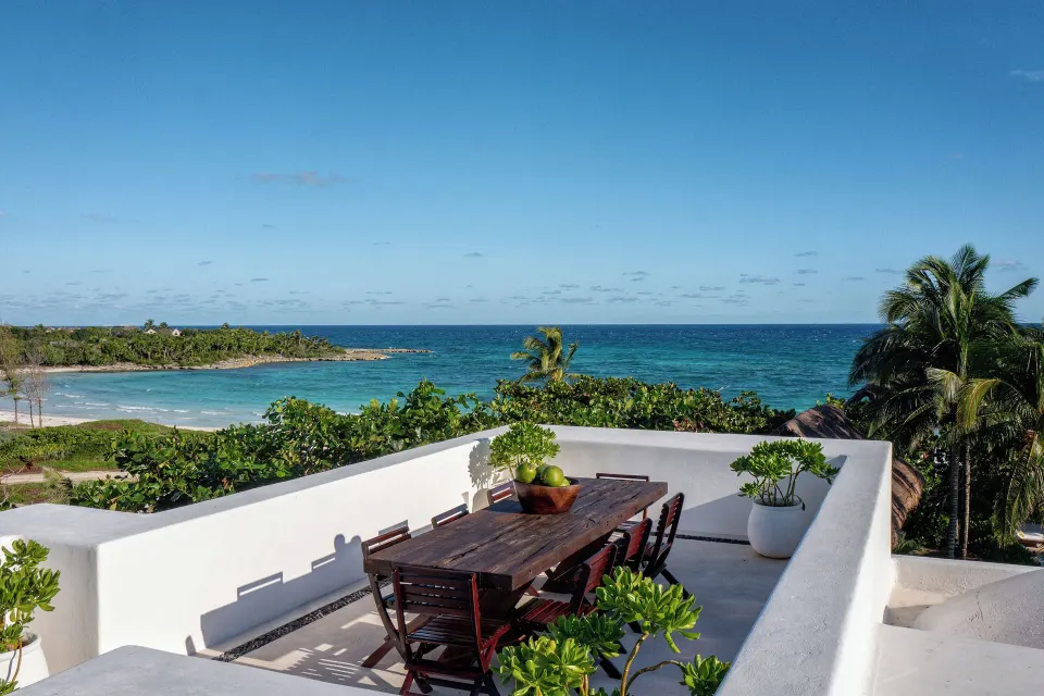 Rooftop dining table and ocean view from The Esencia suite at Hotel Esencia.