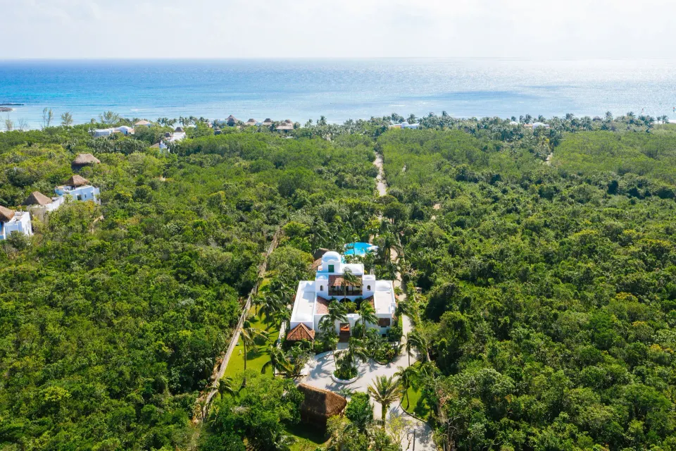 Aerial view of Yum-Ha Private Villa grounds and surrounding tropical forest at Hotel Esencia.