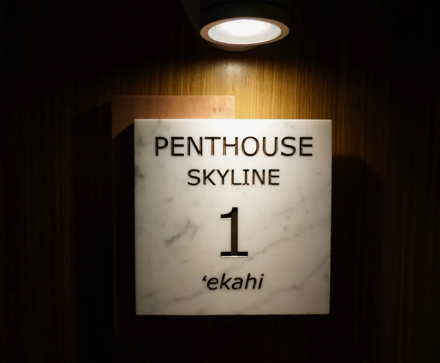 Illuminated penthouse skyline room sign at Hotel La Croix.