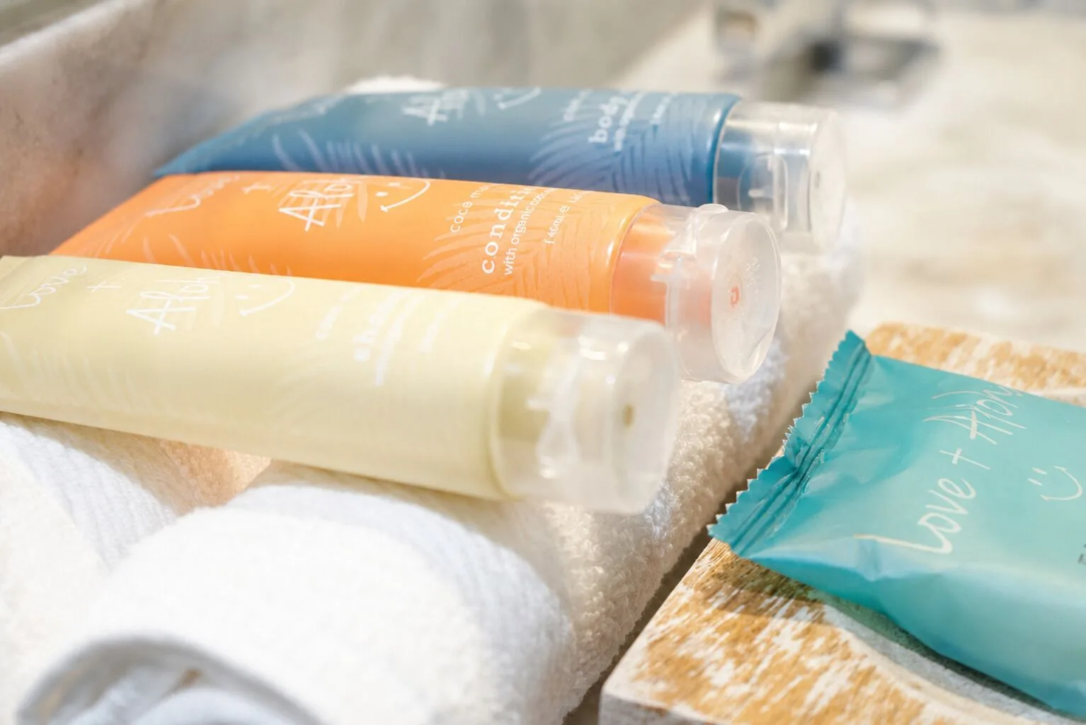 Ali'i Waikiki Two bath amenities arranged on towels at Hotel La Croix.