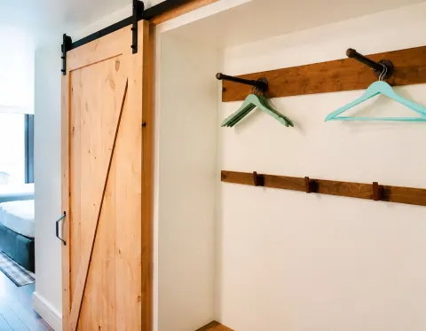 Ali'i Waikiki Two closet area with sliding wood door at Hotel La Croix.