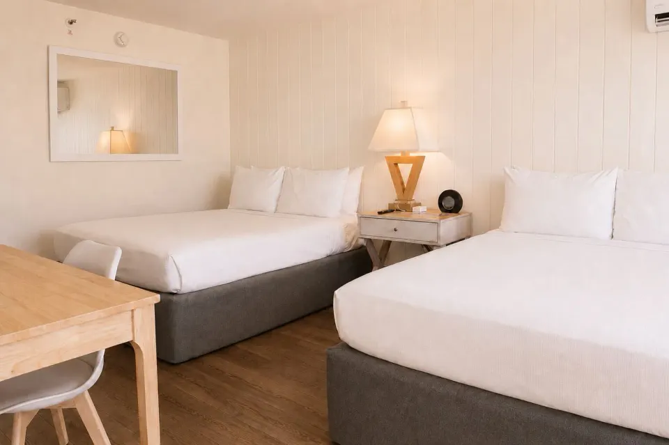 Penthouse Hoku Terrace Oceanview room with two beds, desk, chair, and nightstand at Hotel La Croix.