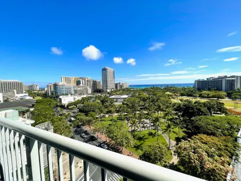 Ocean and park view from a Premium Kalakaua Haus Oceanview room lanai at Hotel La Croix.