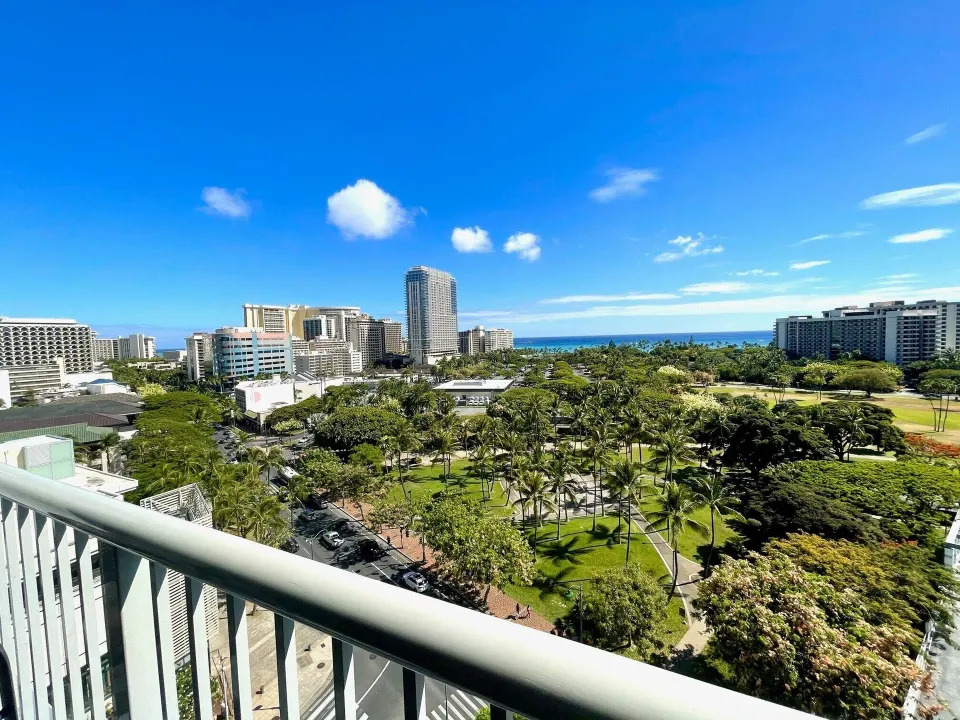 Ocean and park view from a Premium Kalakaua Haus Oceanview room lanai at Hotel La Croix.