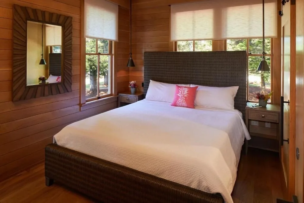 City View room at Hotel Lanai with a bed between windows and bedside tables.