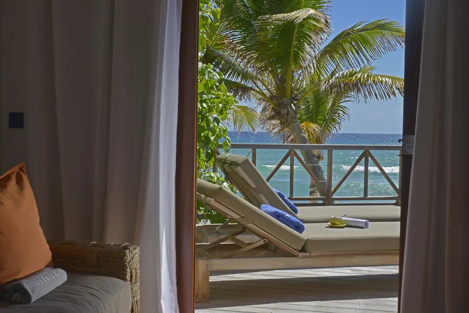 Junior Suite Beach View terrace daybeds seen from the room at Hotel Manapany.