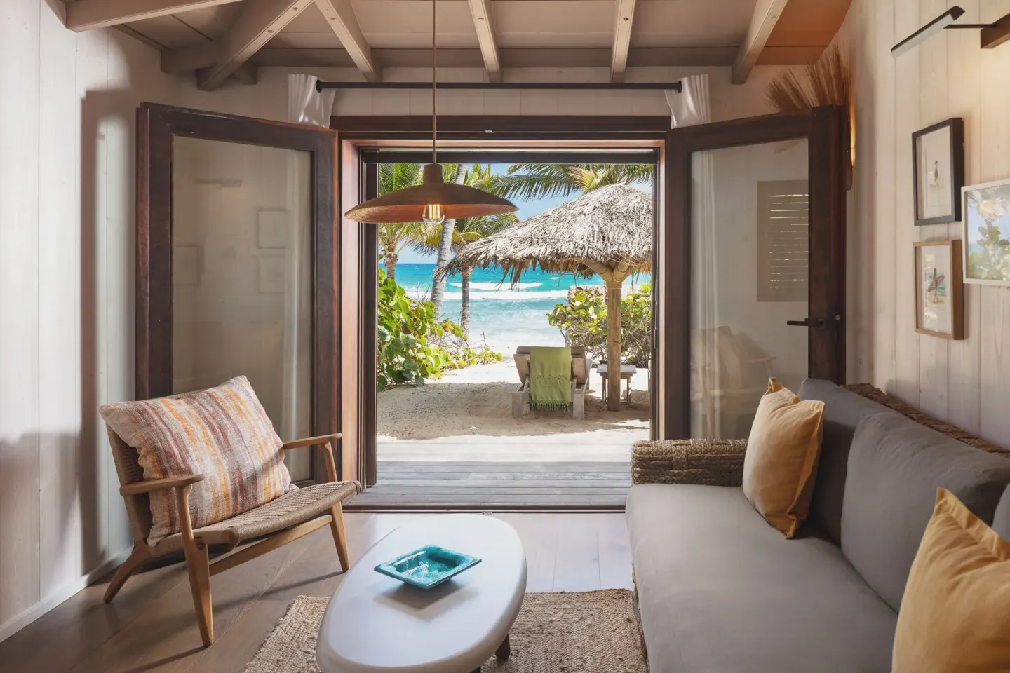 Junior Suite Beach View sitting room opening to the beach at Hotel Manapany.