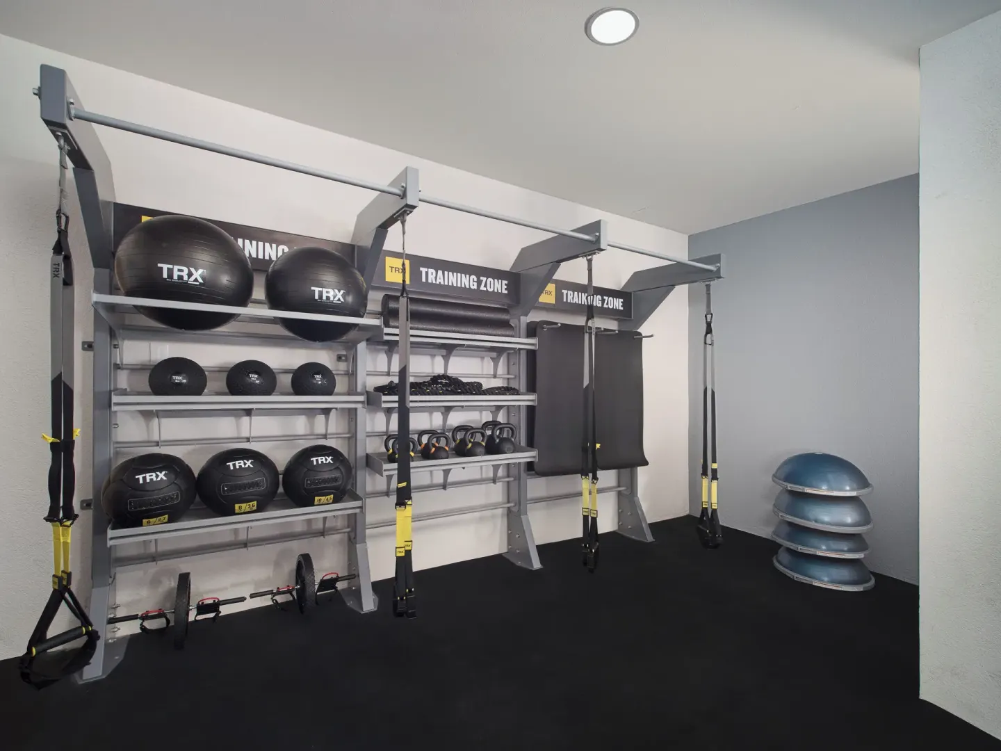 Training equipment and suspension straps in the fitness room at Hotel Marina El Cid Spa & Beach Resort.
