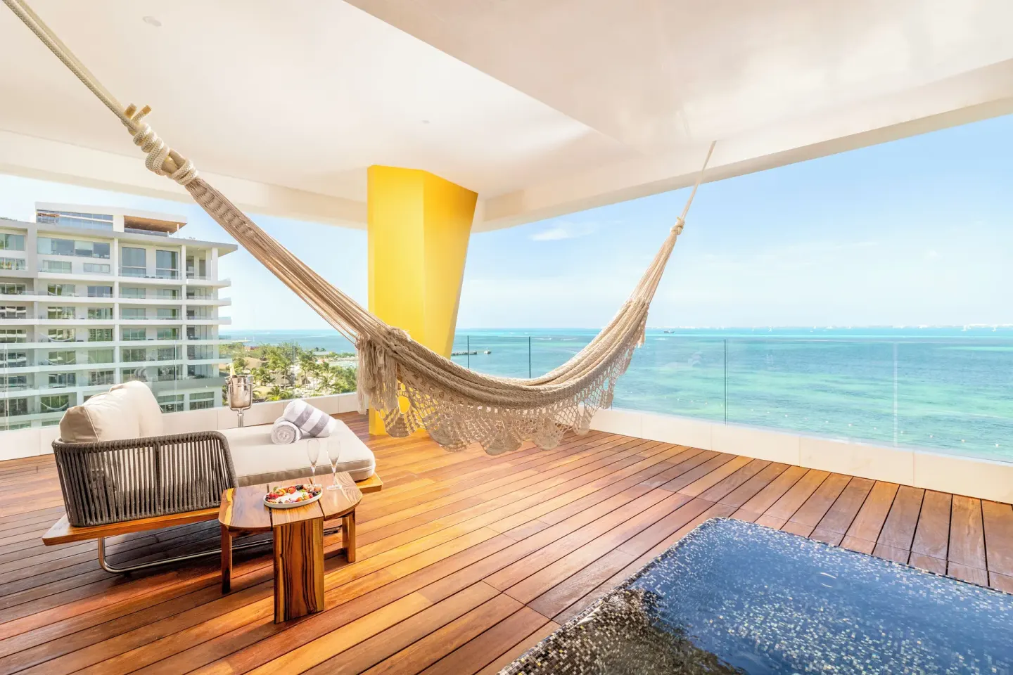 Corner Suite Ocean Front terrace hammock and plunge pool at Hotel Mousai Cancun.