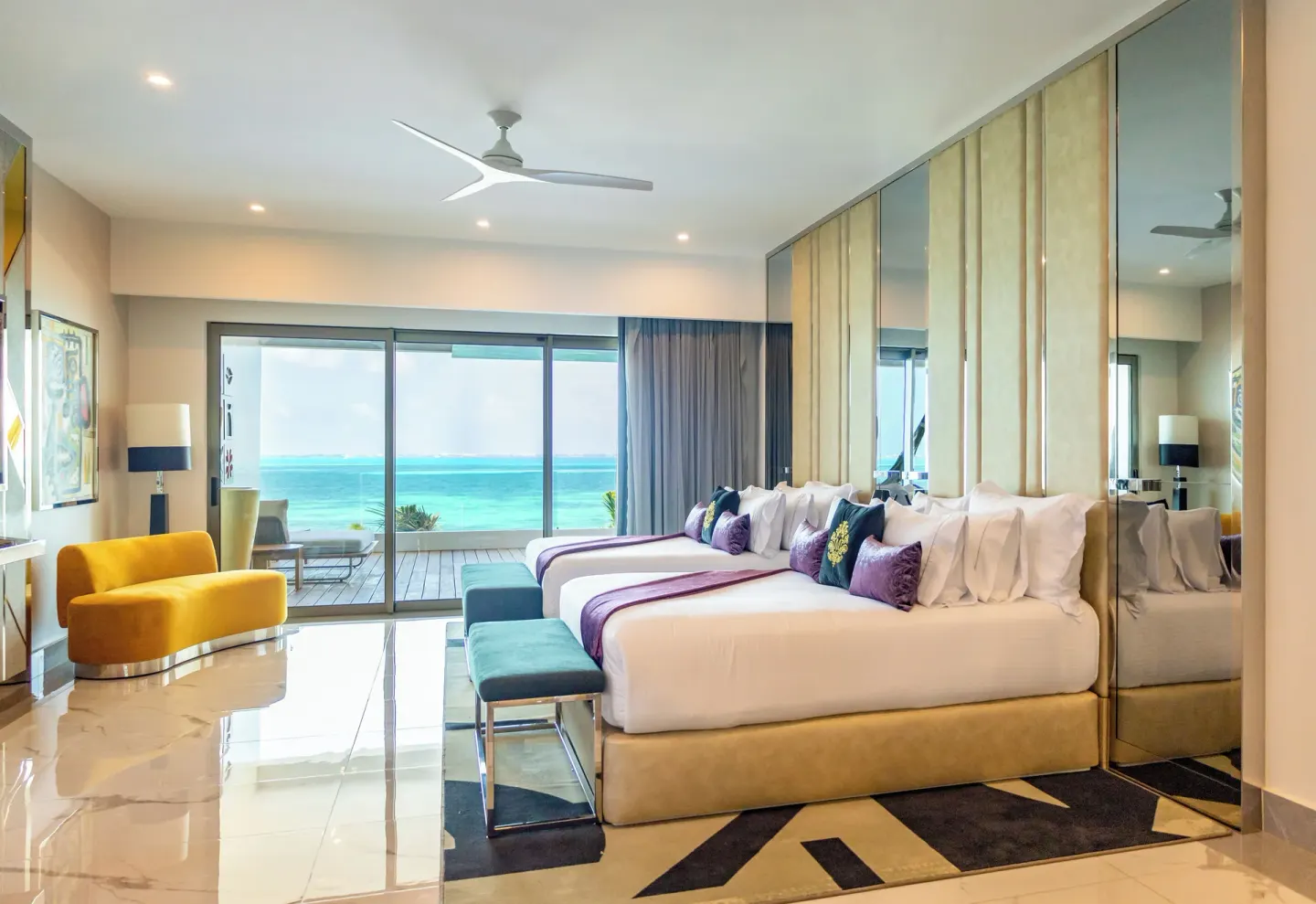 Suite ocean front two-bed room with balcony and sea view at Hotel Mousai Cancun.