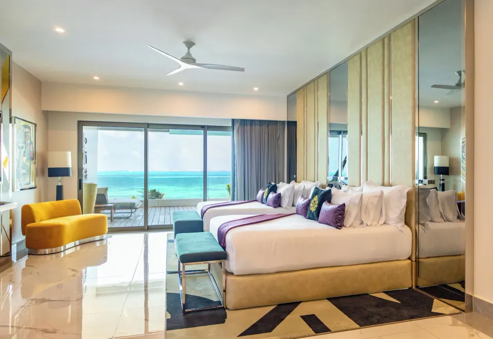 Suite ocean front two-bed room with balcony and sea view at Hotel Mousai Cancun.