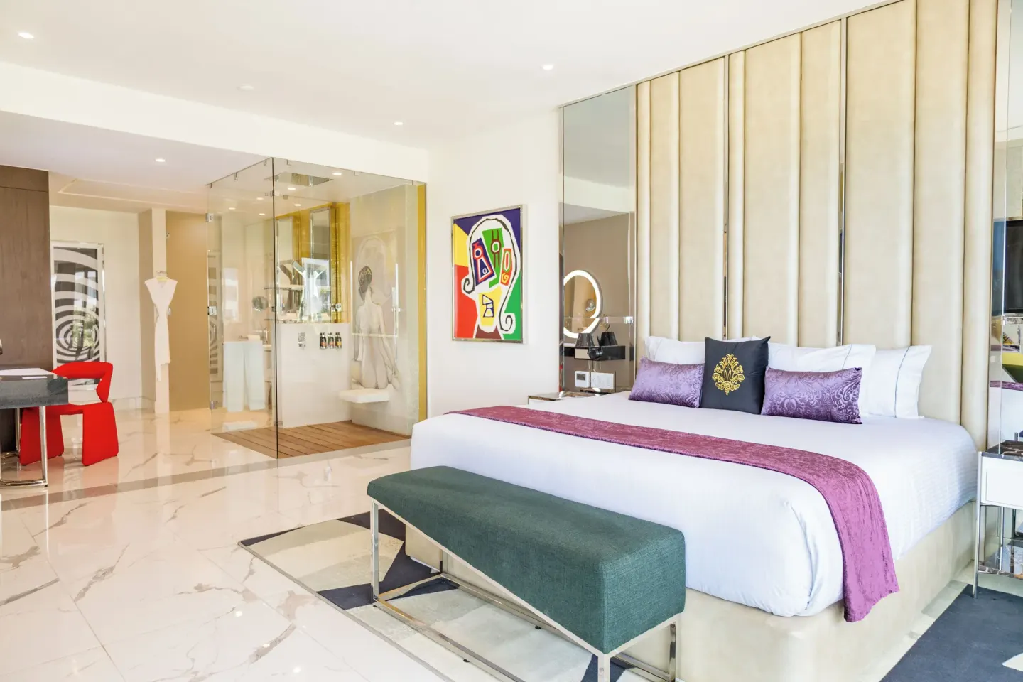 King bed, glass shower, and desk in a Two Bedroom Master Suite at Hotel Mousai Cancun.