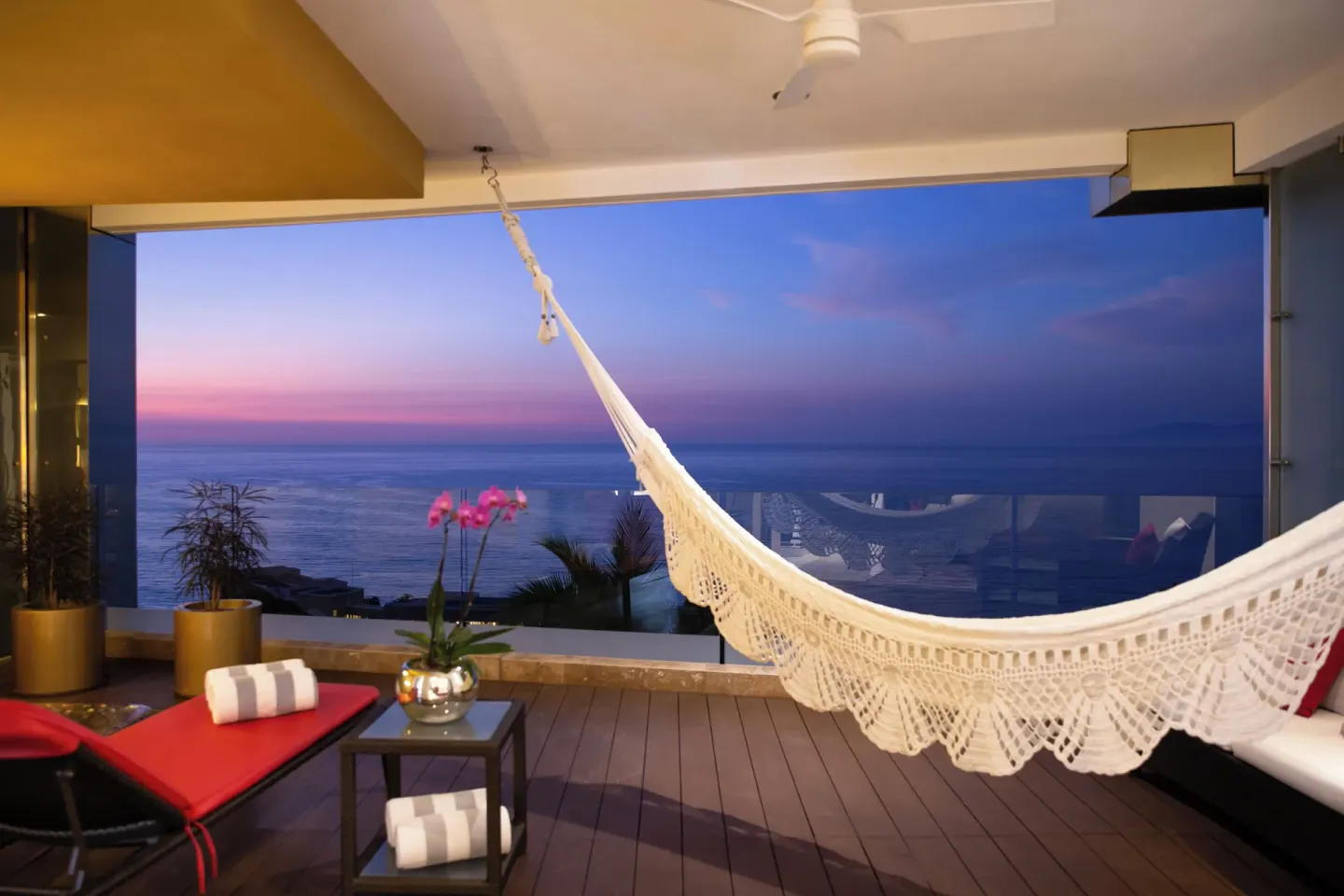 Evening terrace with hammock and ocean horizon at Hotel Mousai Puerto Vallarta.