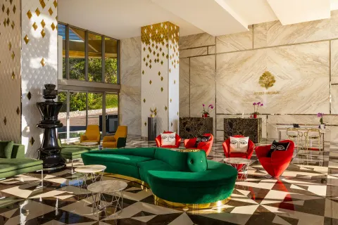 Colorful lobby seating and marble walls at Hotel Mousai Puerto Vallarta.