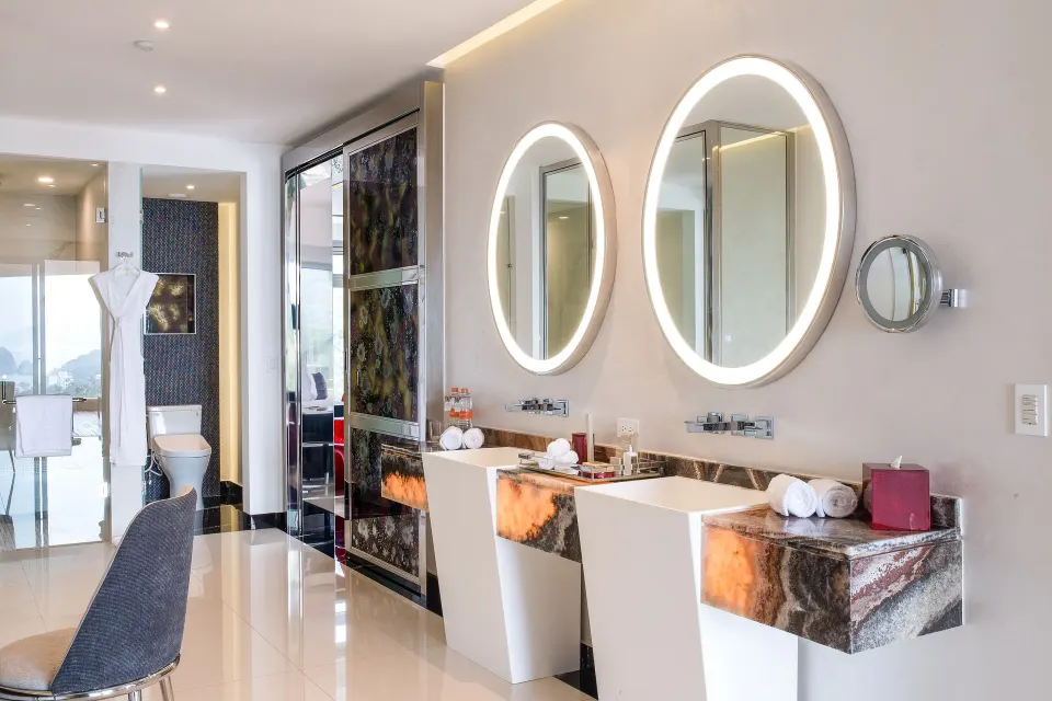 Corner Suite double vanity and illuminated mirrors at Hotel Mousai Puerto Vallarta.