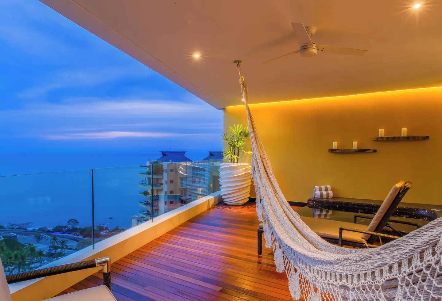 Corner Suite terrace with hammock and ocean view at Hotel Mousai Puerto Vallarta.