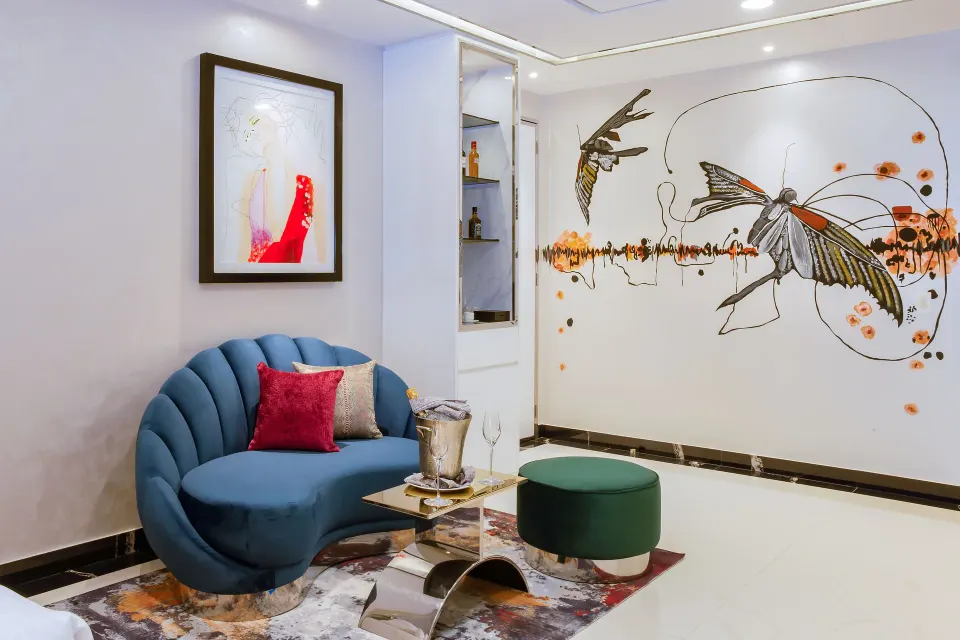 Ultra Two Bedroom Suite sitting area with butterfly wall art at Hotel Mousai Puerto Vallarta.