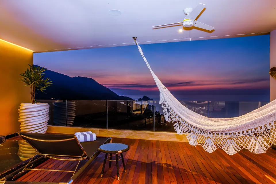 Ultra Two Bedroom Suite balcony hammock at sunset at Hotel Mousai Puerto Vallarta.