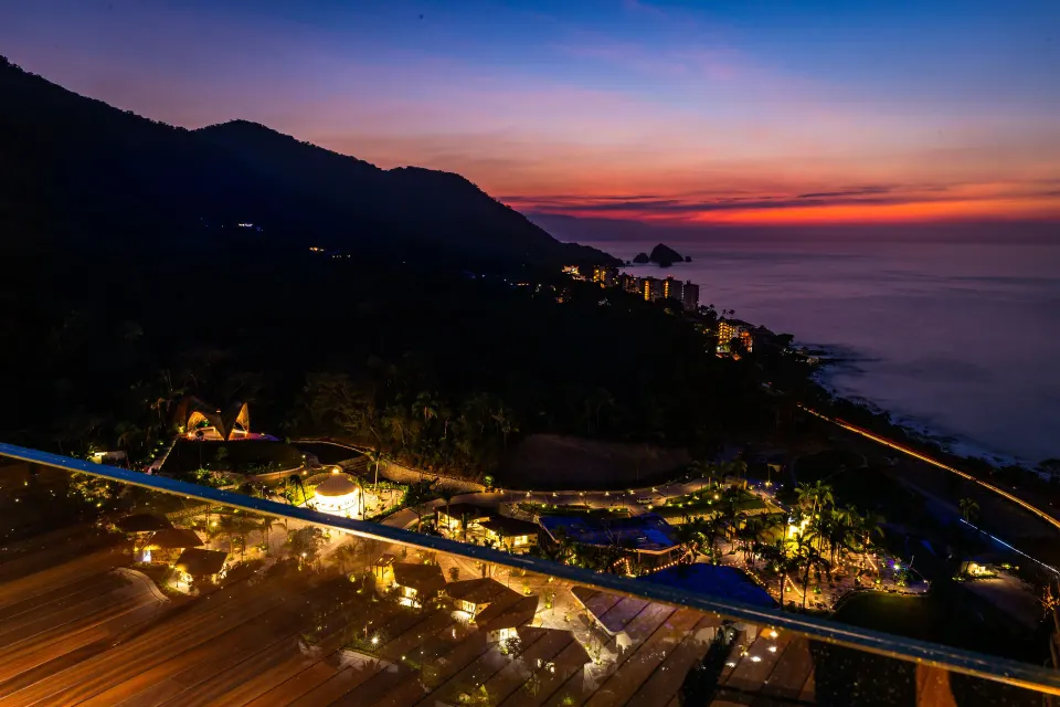Ultra room balcony view of coastline and sunset at Hotel Mousai Puerto Vallarta.