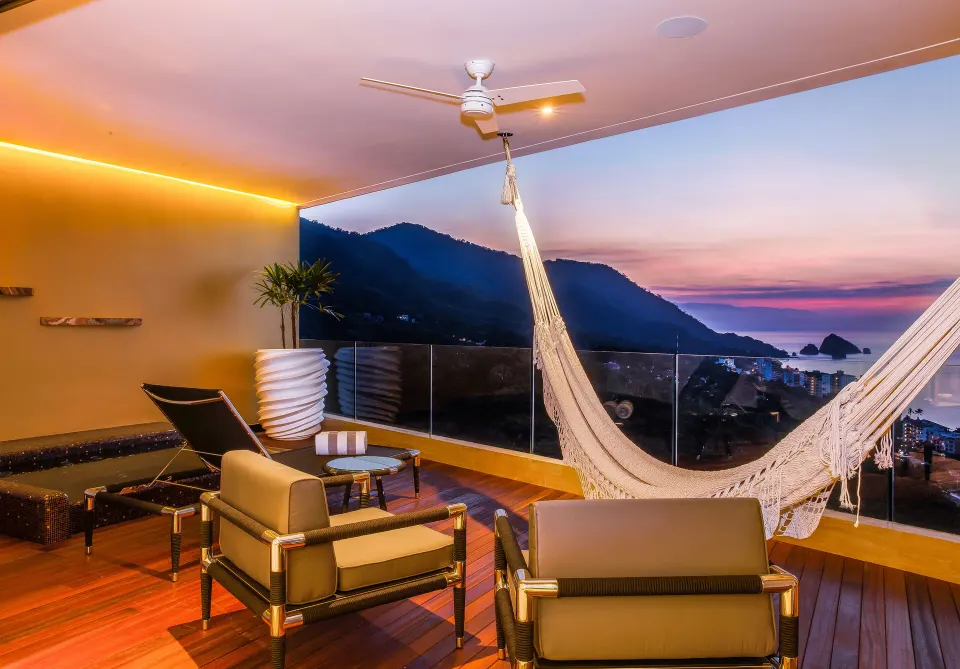 Ultra suite terrace with hammock and bay view at Hotel Mousai Puerto Vallarta.