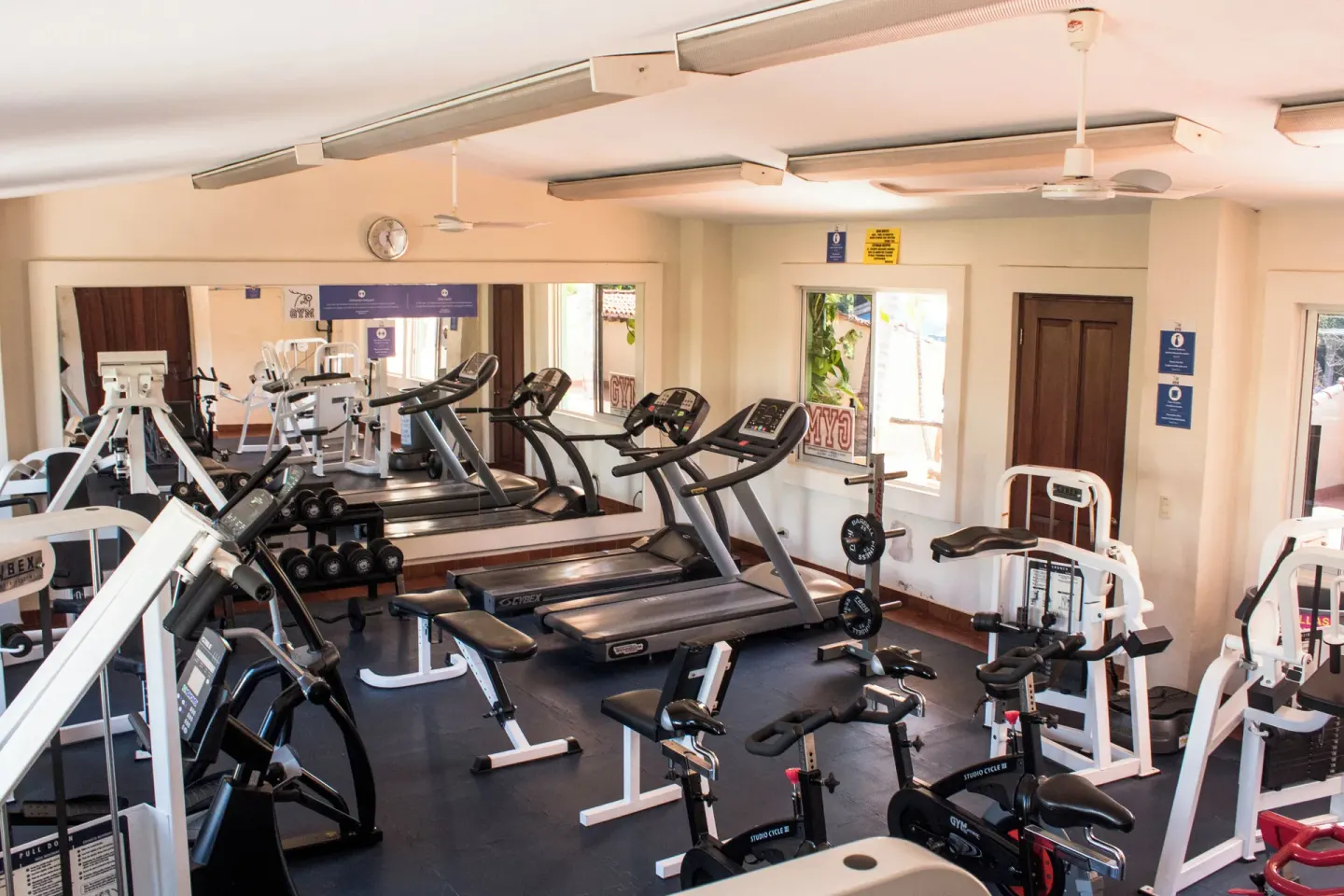 Fitness room with treadmills, weights, bikes, and strength machines at Hotel Playa Mazatlan.